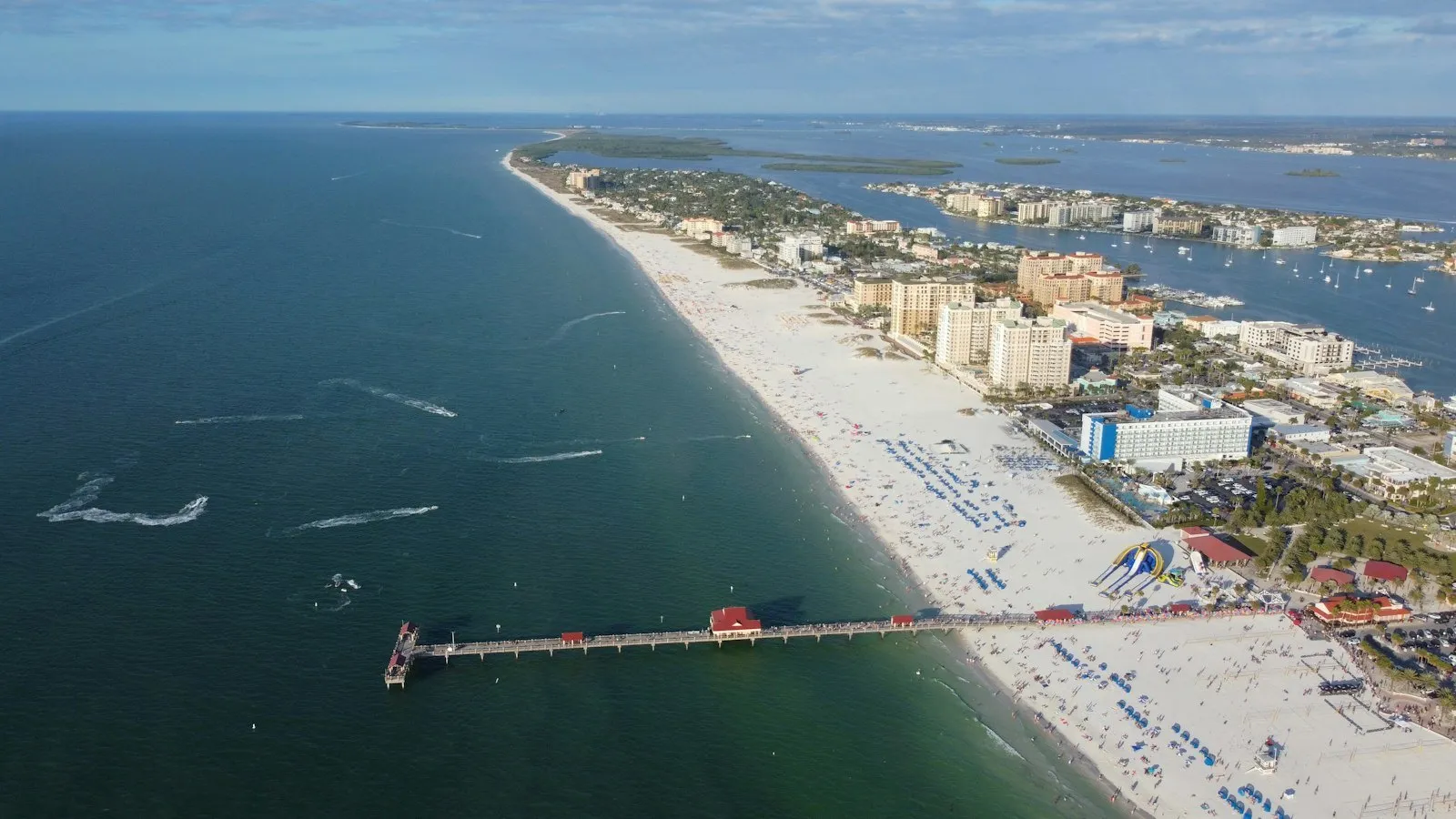 Clearwater Beach and Pier 60 seen from the air, with hotels along the white sand